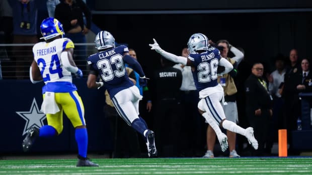 Oct 29, 2023; Arlington, Texas, USA; Dallas Cowboys cornerback DaRon Bland (26) scores a touchdown on an interception during the first quarter against the Los Angeles Rams at AT&T Stadium